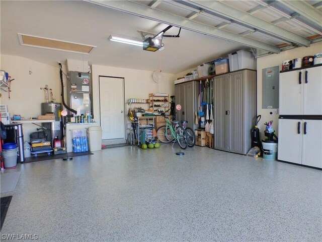 garage featuring water heater, a garage door opener, and heating unit