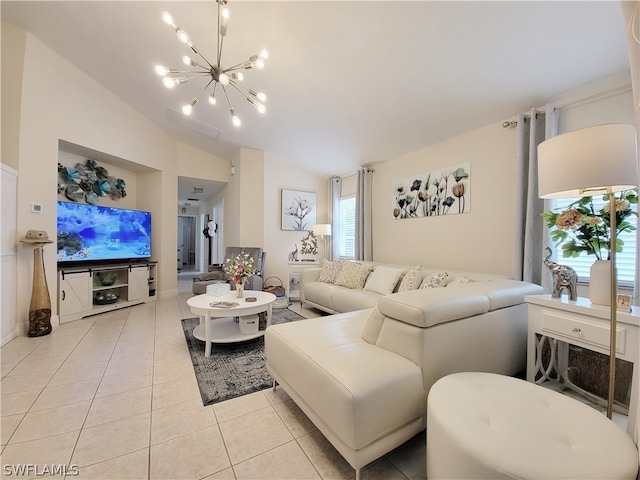 tiled living room featuring a chandelier, a healthy amount of sunlight, and vaulted ceiling