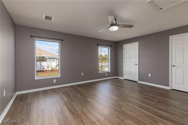 unfurnished bedroom featuring dark hardwood / wood-style floors and ceiling fan