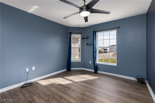 unfurnished room with hardwood / wood-style floors and ceiling fan