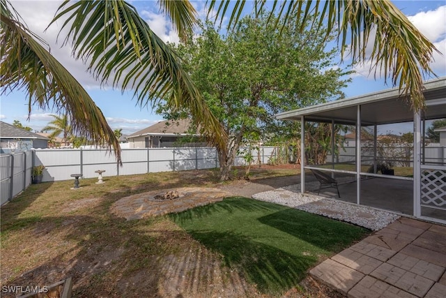 view of yard with a sunroom