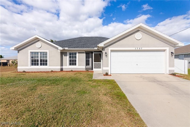 ranch-style house featuring a front lawn and a garage