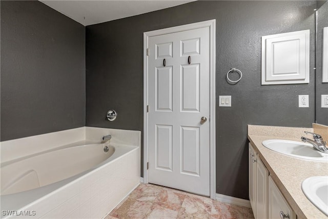 bathroom with a bathing tub and vanity