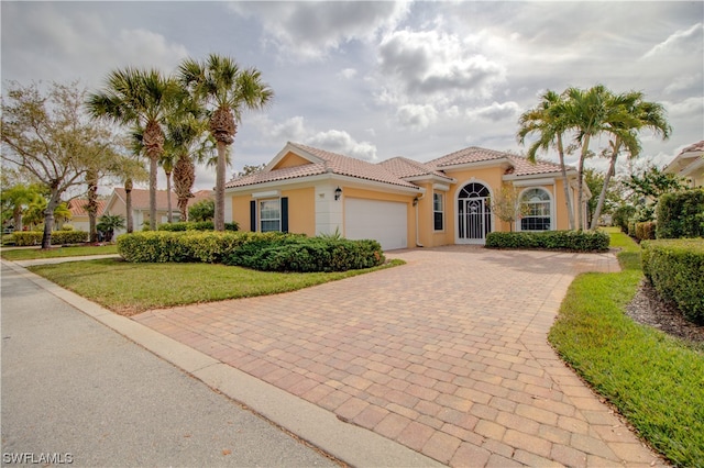 mediterranean / spanish-style house featuring a garage