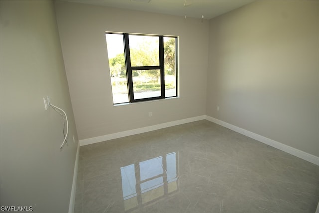 spare room featuring tile floors