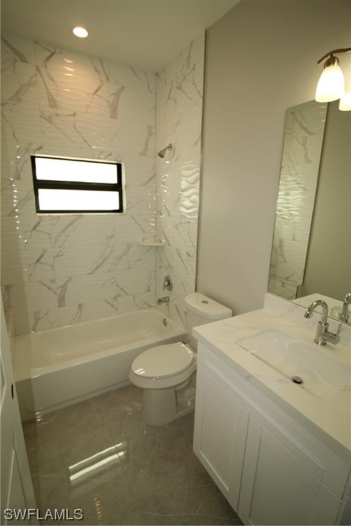 full bathroom with vanity, toilet, tile floors, and tiled shower / bath combo