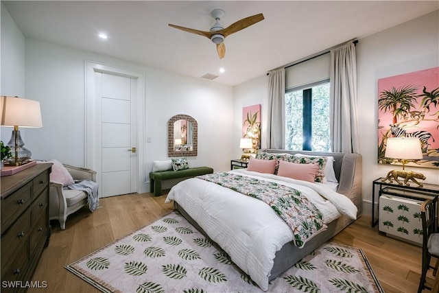 bedroom featuring recessed lighting, wood finished floors, visible vents, and ceiling fan