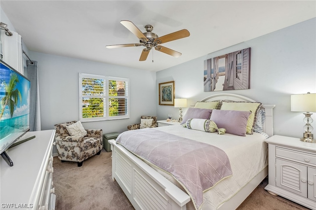 bedroom with light colored carpet and ceiling fan