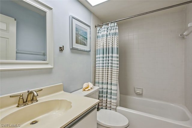 full bathroom featuring shower / tub combo, vanity with extensive cabinet space, and toilet