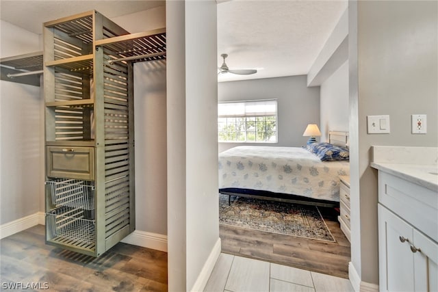 bedroom featuring hardwood / wood-style floors and ceiling fan