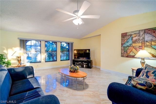 living room featuring ceiling fan, vaulted ceiling, and light tile patterned flooring