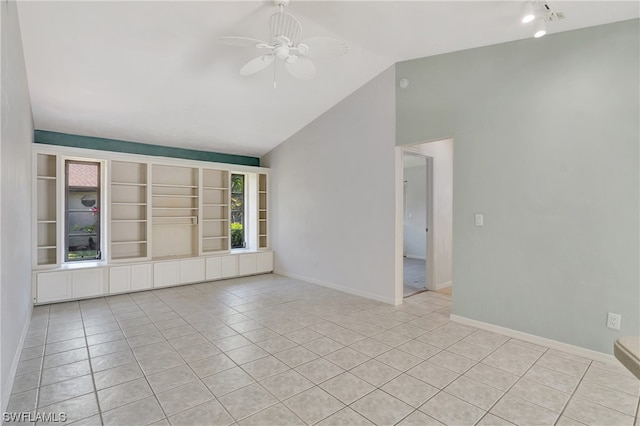 unfurnished room featuring light tile patterned floors, ceiling fan, and lofted ceiling