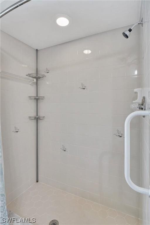 bathroom with tiled shower