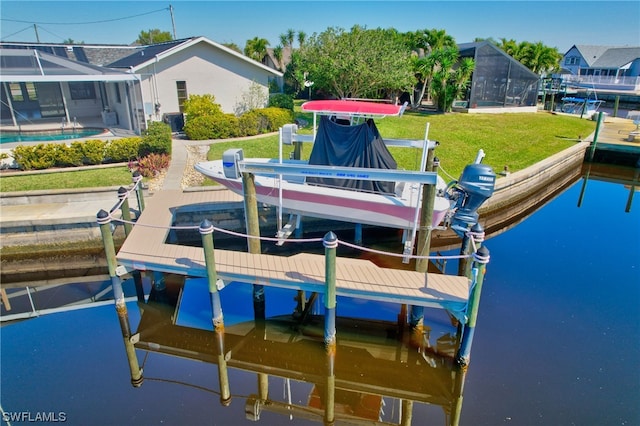 dock area featuring a water view and a yard