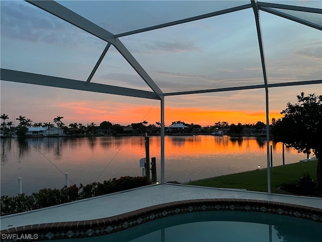 pool at dusk with a water view