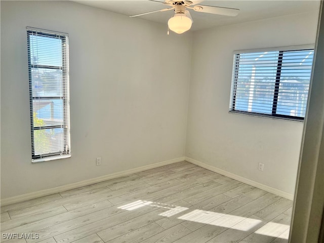 unfurnished room with ceiling fan and light hardwood / wood-style flooring