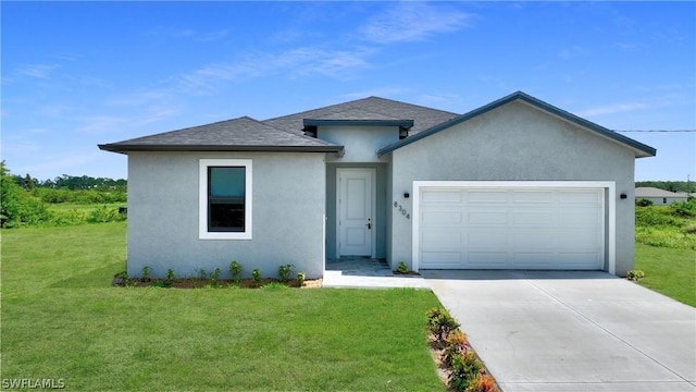 view of front facade with a garage and a front yard