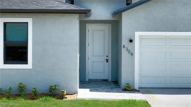 entrance to property featuring a garage