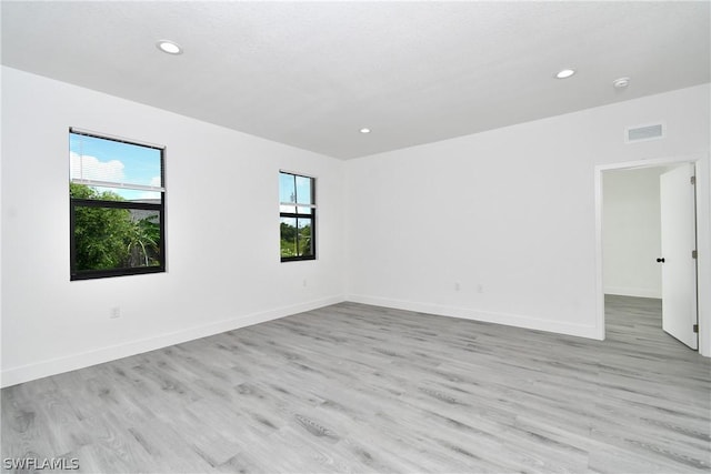 unfurnished room featuring light wood-type flooring