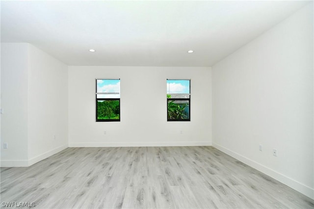 unfurnished room featuring light wood-type flooring