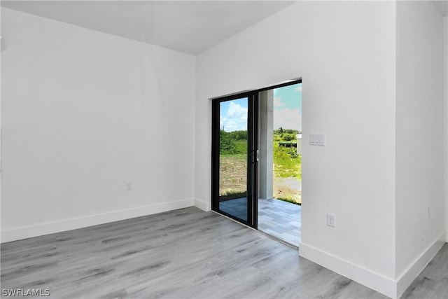 doorway to outside with light hardwood / wood-style floors