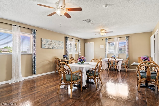 dining area featuring a healthy amount of sunlight and dark wood-type flooring