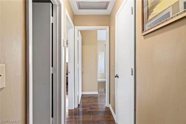 hallway featuring dark wood-type flooring