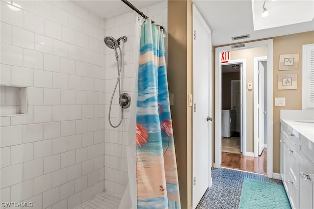 bathroom with a shower with curtain, vanity, and tile floors