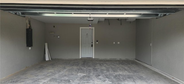 garage featuring electric panel and a garage door opener