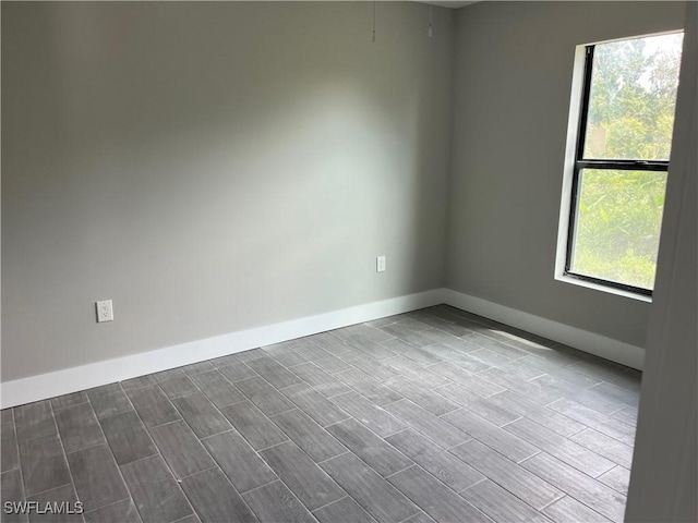 empty room with wood-type flooring