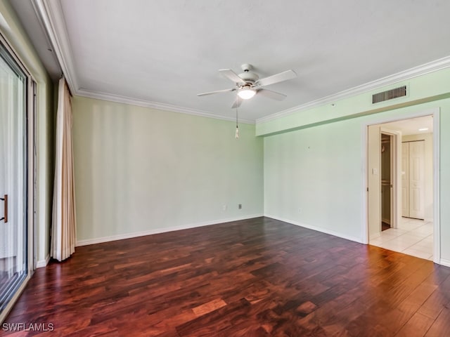 spare room with ceiling fan, crown molding, and light hardwood / wood-style flooring