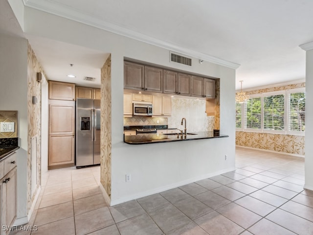 kitchen with stainless steel appliances, crown molding, sink, light tile patterned floors, and pendant lighting