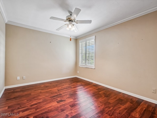 empty room featuring crown molding, dark hardwood / wood-style flooring, and ceiling fan