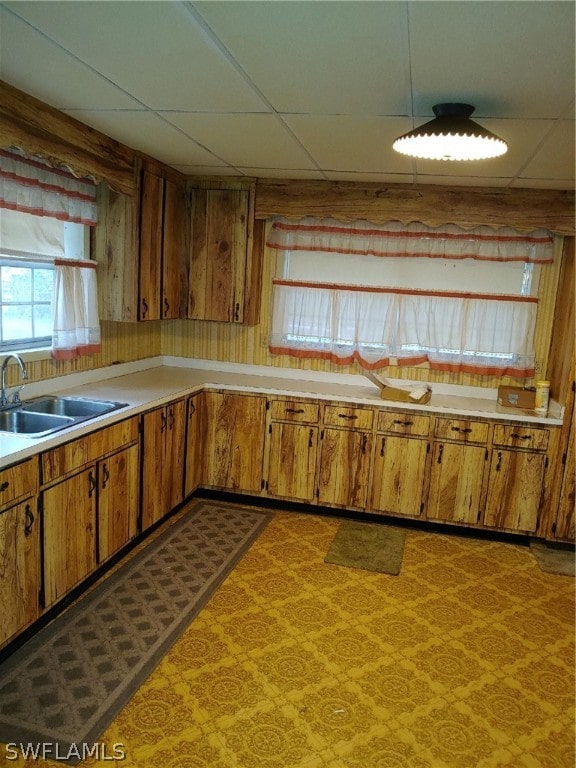 kitchen featuring sink and a drop ceiling