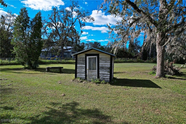 view of outdoor structure with a lawn