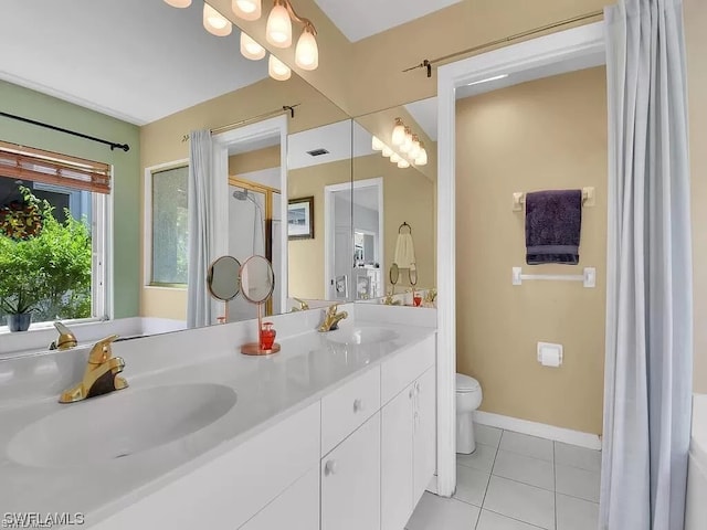 bathroom featuring toilet, tile floors, dual sinks, and large vanity