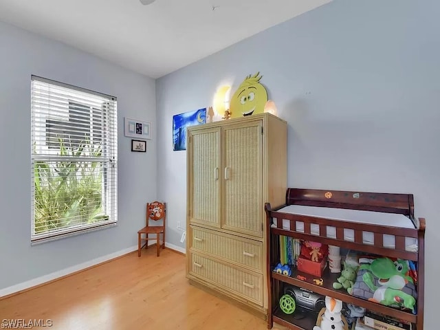 bedroom with light hardwood / wood-style flooring