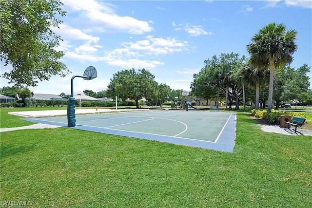 view of basketball court featuring a yard