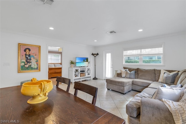 tiled living room featuring ornamental molding