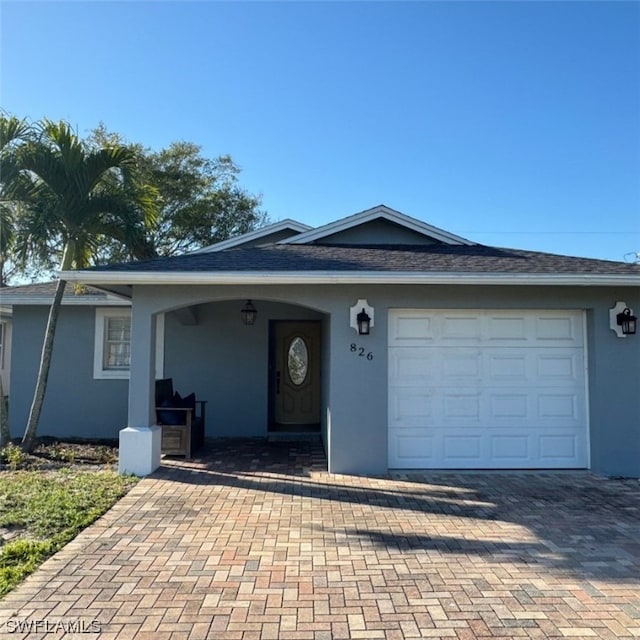 single story home with a garage