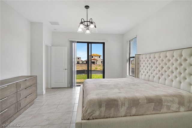 bedroom with access to outside, a chandelier, and light tile flooring