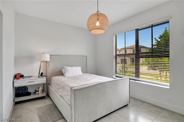 bedroom featuring light tile floors