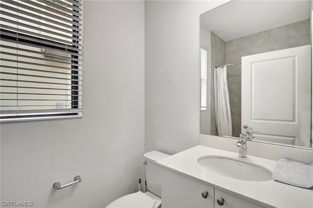 bathroom featuring toilet and oversized vanity