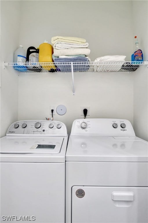 laundry area featuring electric dryer hookup and separate washer and dryer