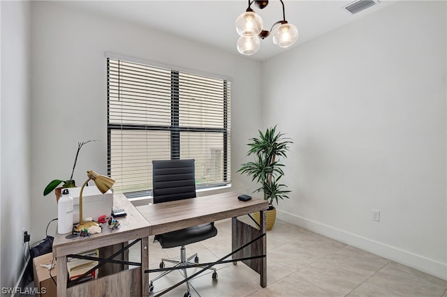 office featuring an inviting chandelier and light tile floors