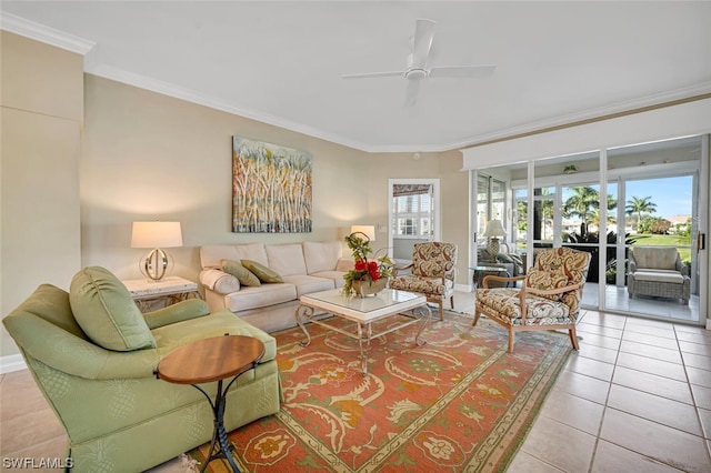 living room featuring light tile floors, ornamental molding, and ceiling fan