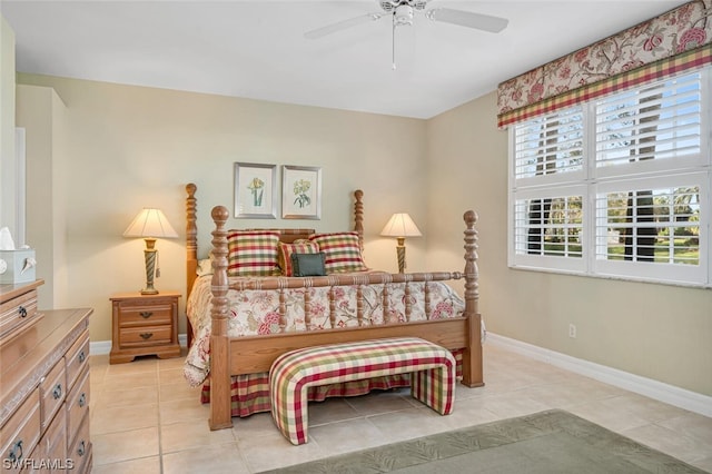 tiled bedroom featuring ceiling fan