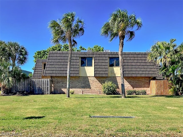 view of property exterior with a yard