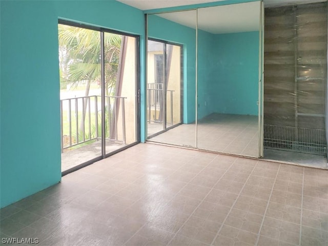 unfurnished room with light tile floors