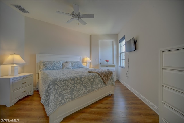 bedroom with ceiling fan and light wood-type flooring